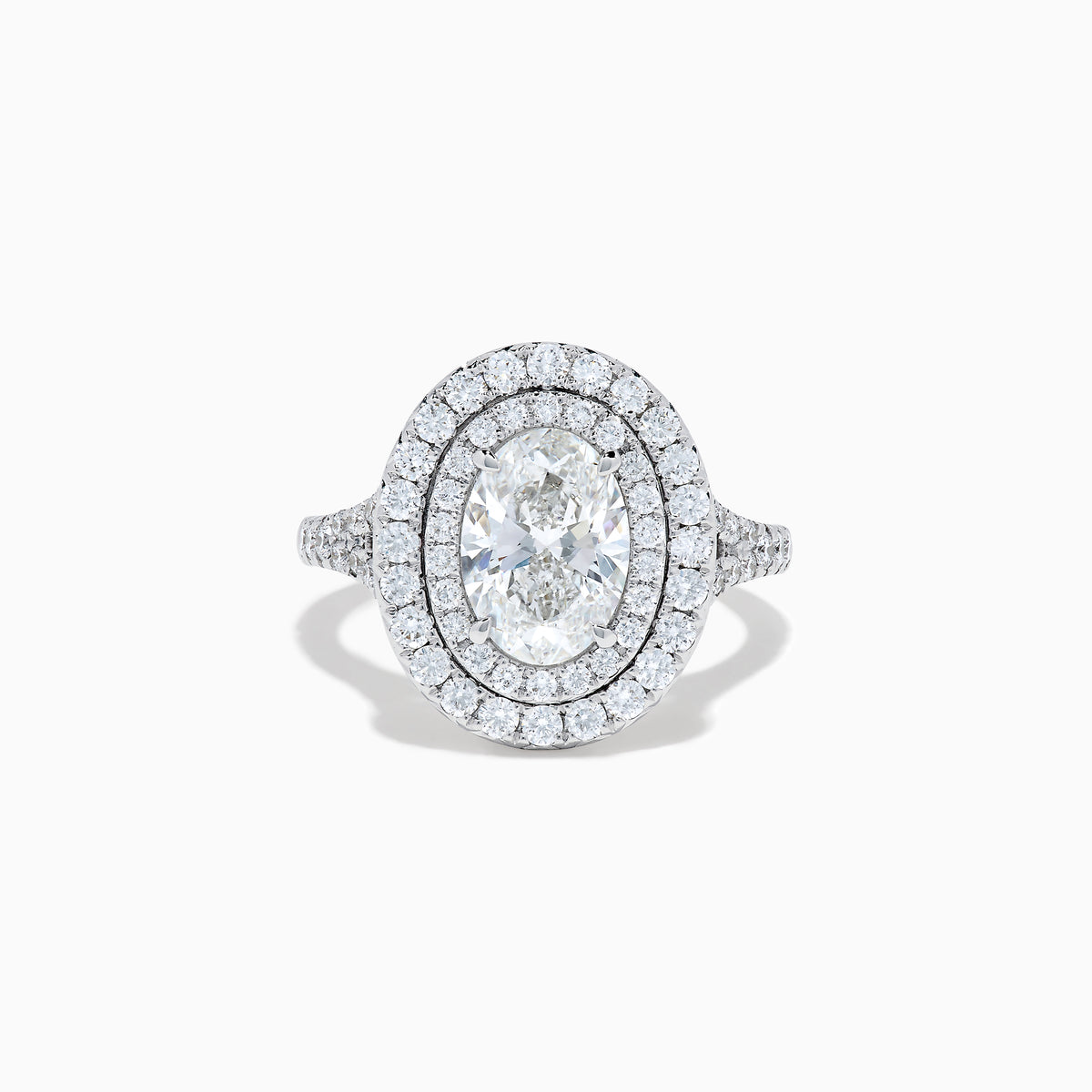 The Lab Grown Oval Diamond Double Halo Ring in 14K White Gold features a dazzling oval center, lab grown diamonds in a double halo, and extra sparkle along the band for an elegant look.