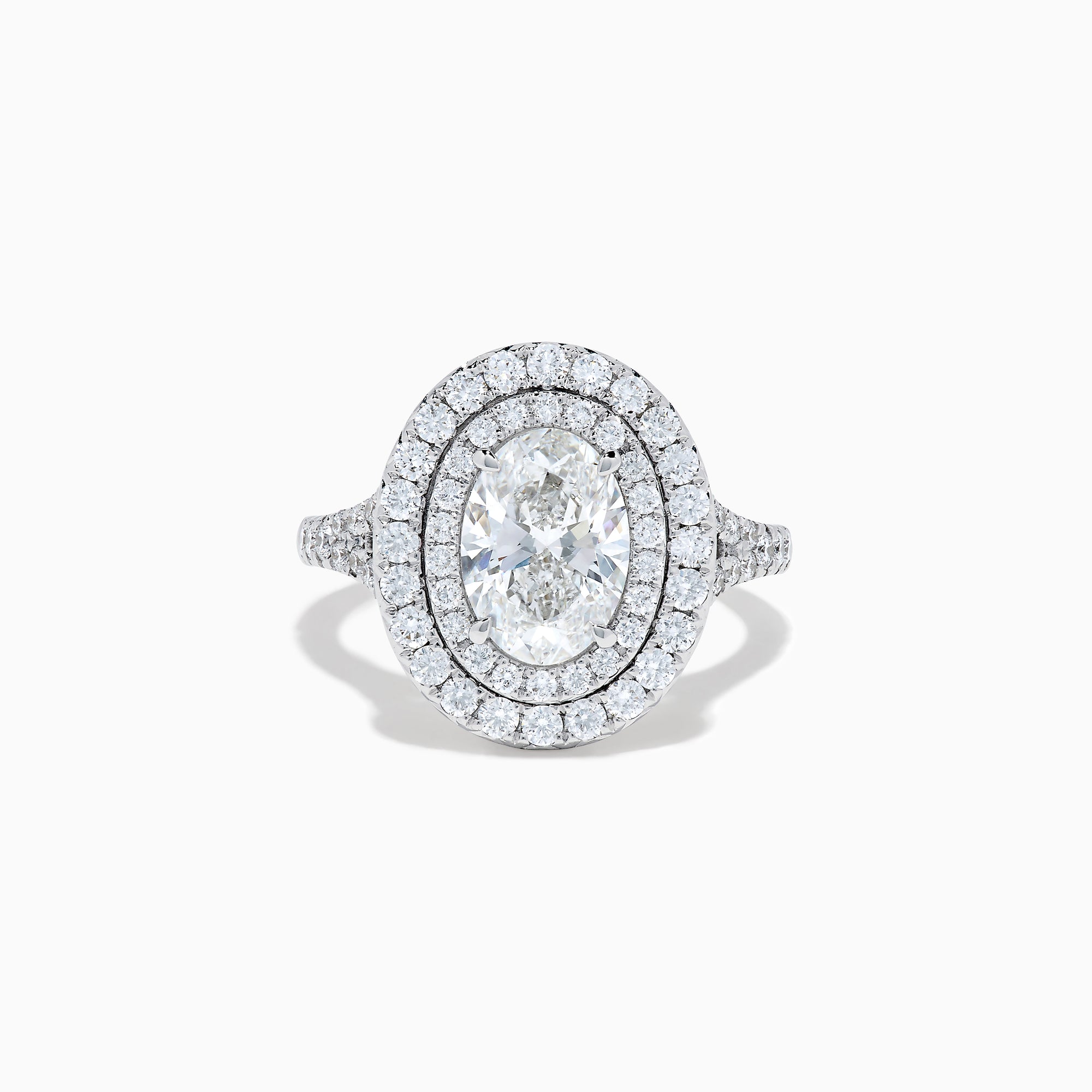 The Lab Grown Oval Diamond Double Halo Ring in 14K White Gold features a dazzling oval center, lab grown diamonds in a double halo, and extra sparkle along the band for an elegant look.
