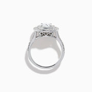 The Lab Grown Oval Diamond Double Halo Ring in 14K White Gold features a dazzling oval center, lab grown diamonds in a double halo, and extra sparkle along the band for an elegant look.
