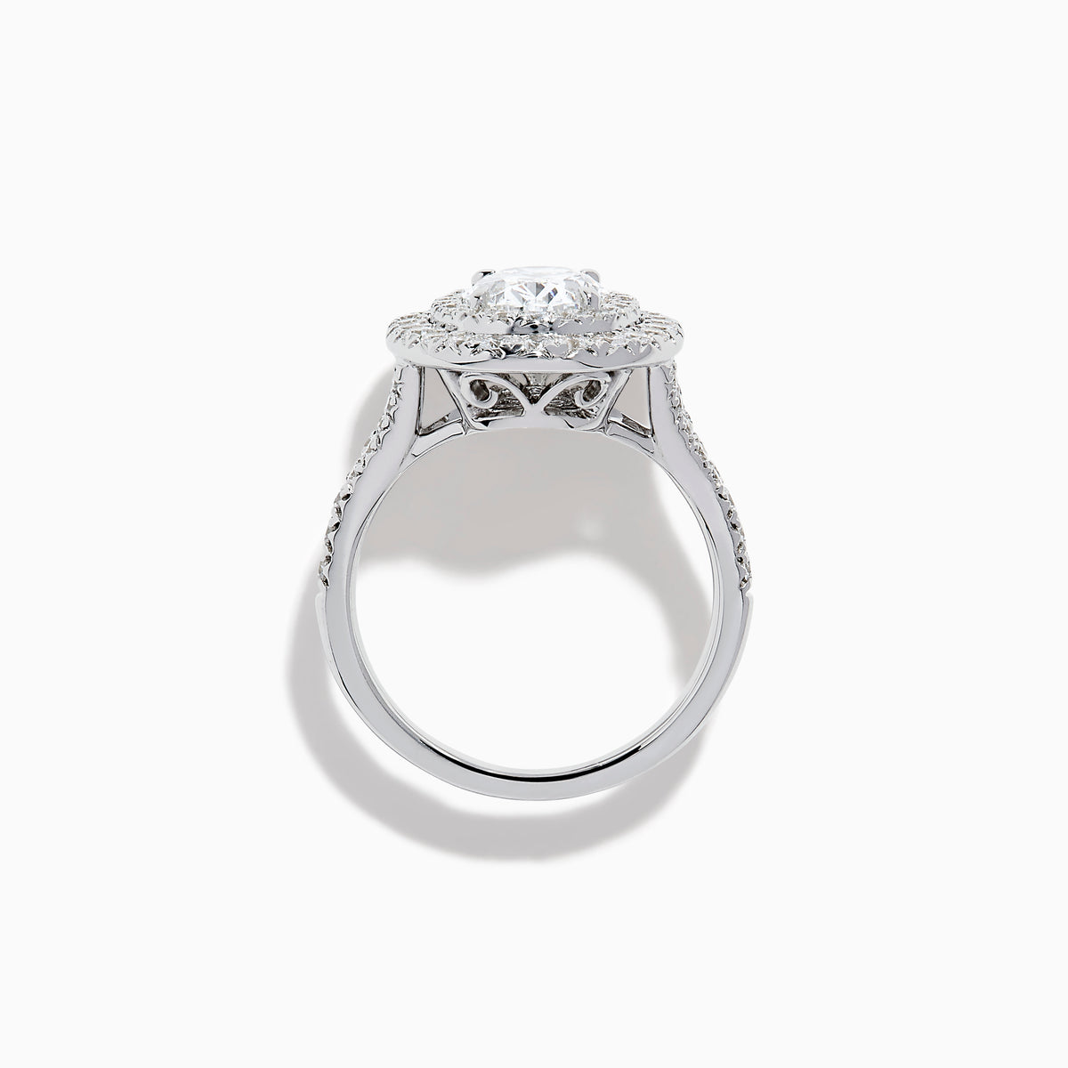 The Lab Grown Oval Diamond Double Halo Ring in 14K White Gold features a dazzling oval center, lab grown diamonds in a double halo, and extra sparkle along the band for an elegant look.