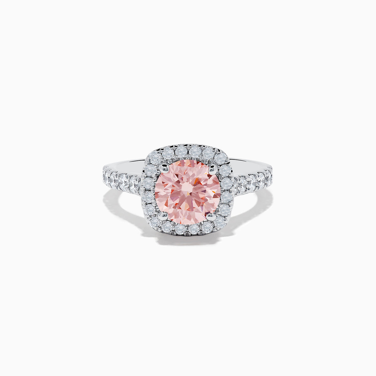 The 14K White Gold Lab Grown Pink and White Diamond Ring features a large oval pink center stone, a halo of lab grown diamonds, and additional diamonds on the band, displayed against a white background.