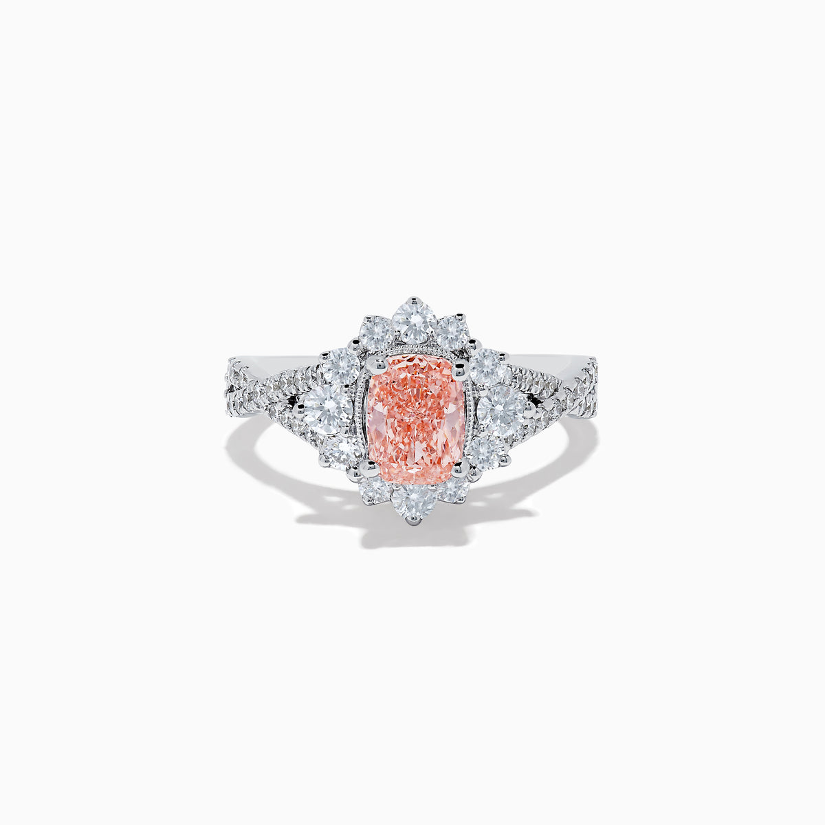The 14K White Gold Lab Grown Pink and White Diamond Ring features an oval pink center stone, a halo of sparkling white diamonds, and additional lab grown diamonds along the band.