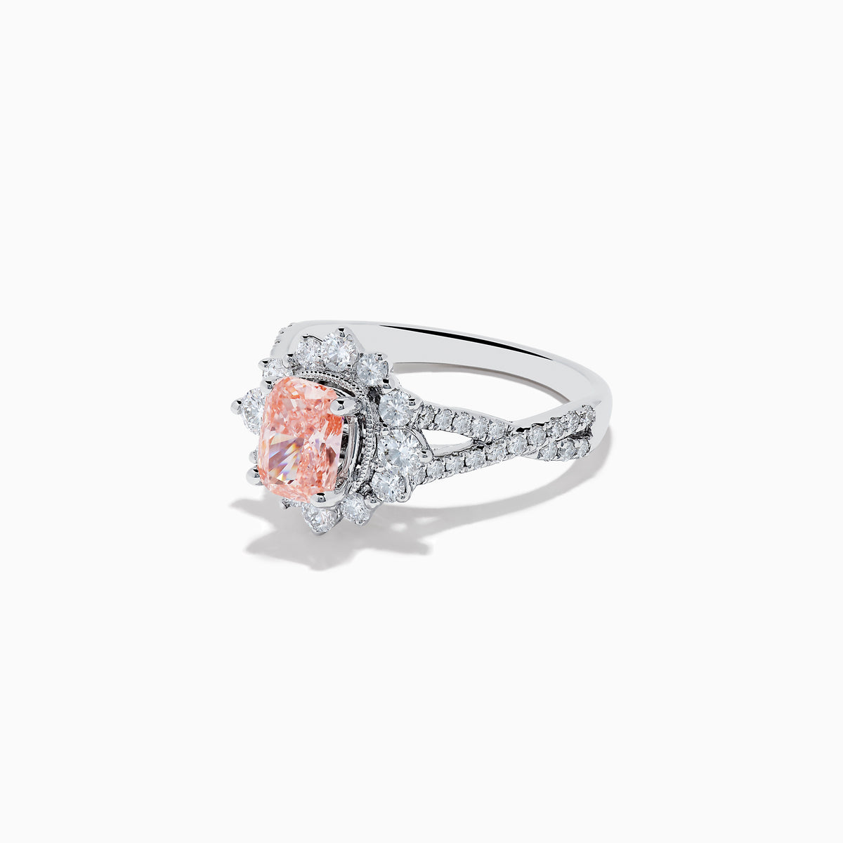 The 14K White Gold Lab Grown Pink and White Diamond Ring features an oval pink center stone, a halo of sparkling white diamonds, and additional lab grown diamonds along the band.