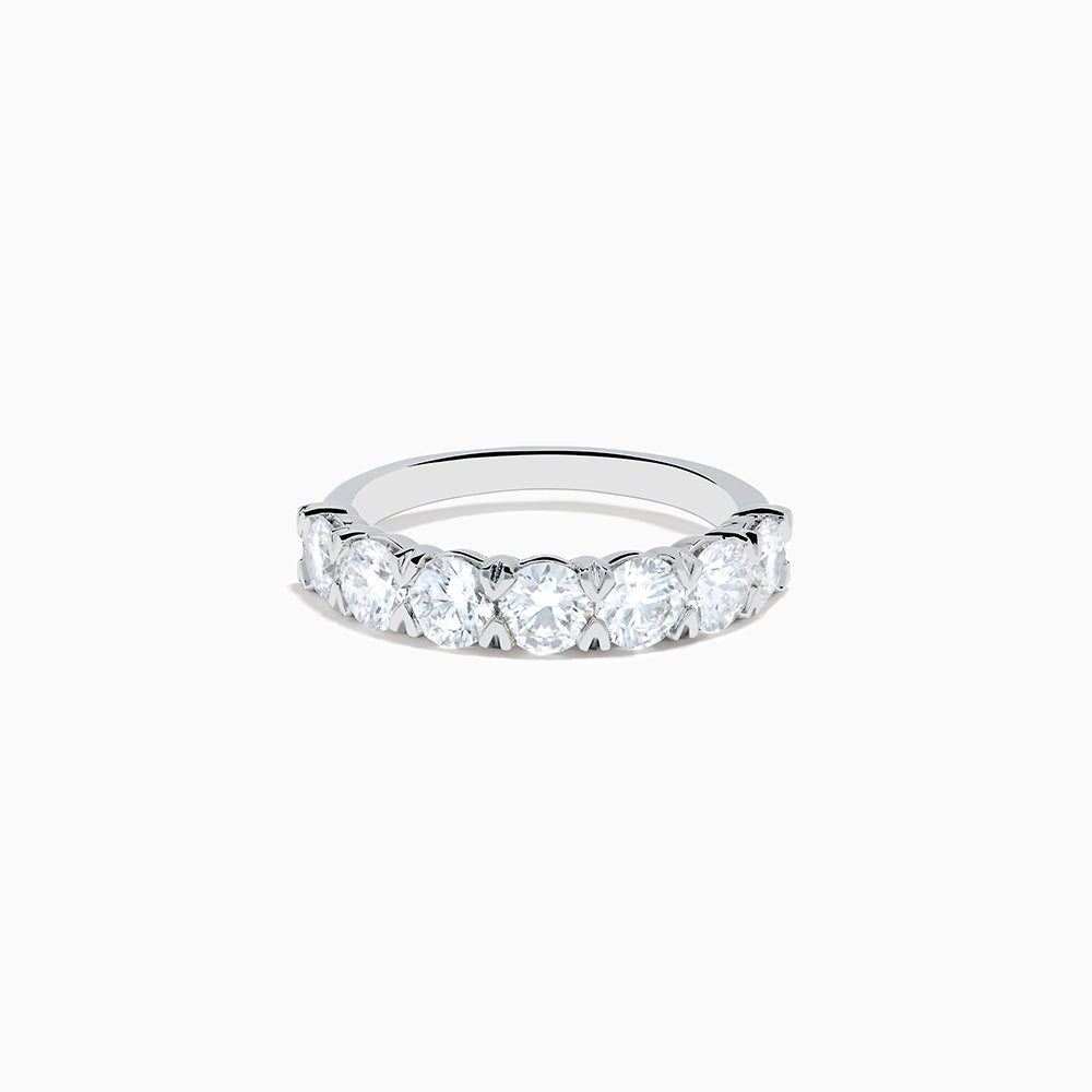 The Lab Grown Diamond Wedding Band in 14K White Gold showcases round, sparkling lab diamonds in a shared-prong setting on a sleek band, set against a white background.