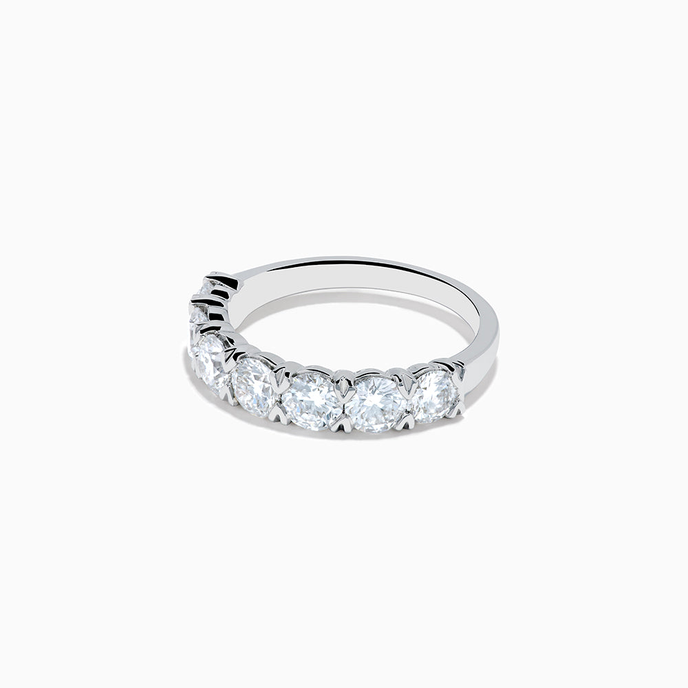 The Lab Grown Diamond Wedding Band in 14K White Gold showcases round, sparkling lab diamonds in a shared-prong setting on a sleek band, set against a white background.