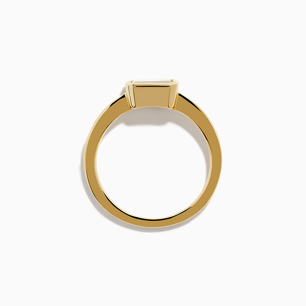 The Lab Grown Diamond East West Emerald-Cut Ring in 14K Yellow Gold features a lab diamond in a minimalist bezel setting, beautifully crafted and shown against a plain white background.