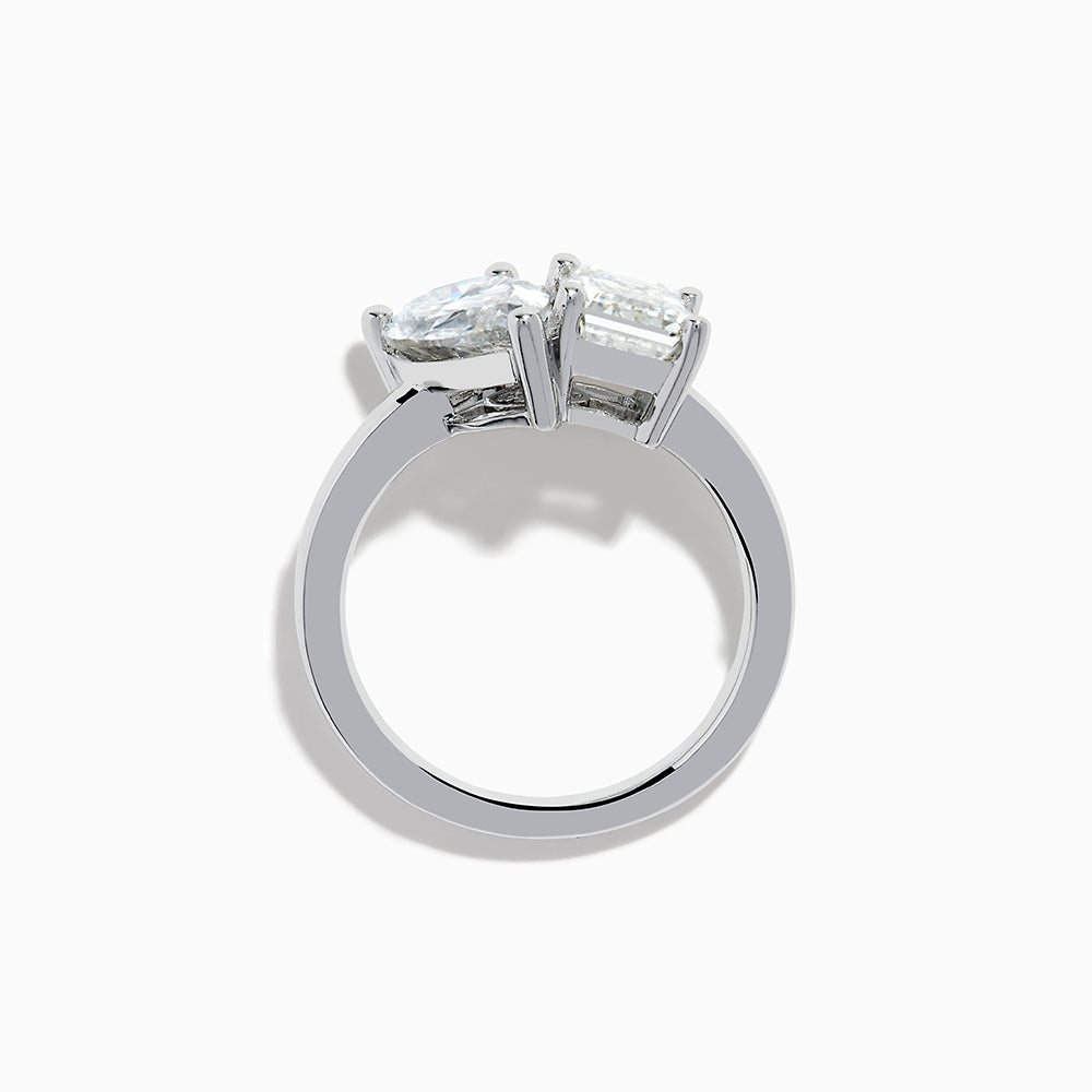 The Lab Grown Diamond Toi Et Moi Ring in 14K White Gold showcases emerald-cut and pear-shaped lab diamonds set side by side on a sleek band, displayed against a white background.