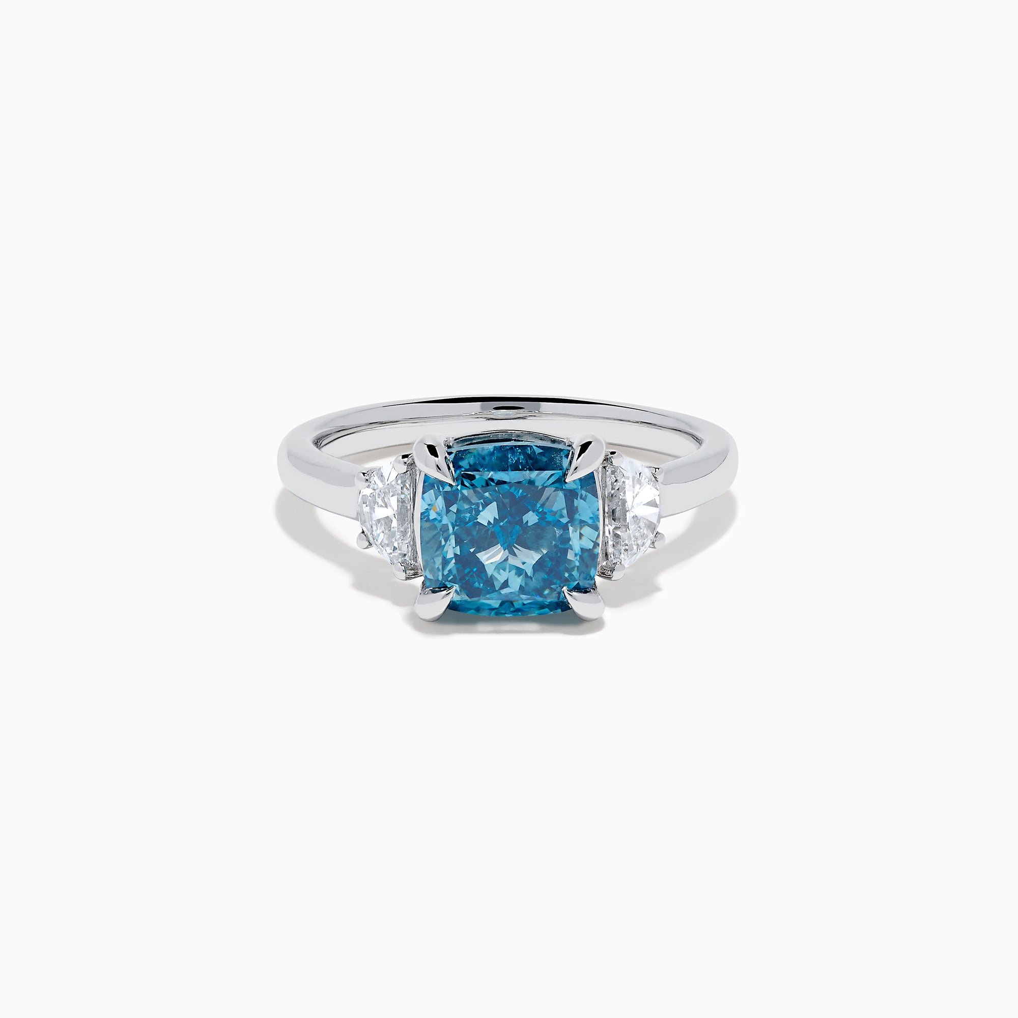 Lab Grown Blue and White Diamond 3-Stone Ring in 14K White Gold, featuring a prominent cushion-cut blue and white diamond center with two clear triangular side stones, shown on a white background.