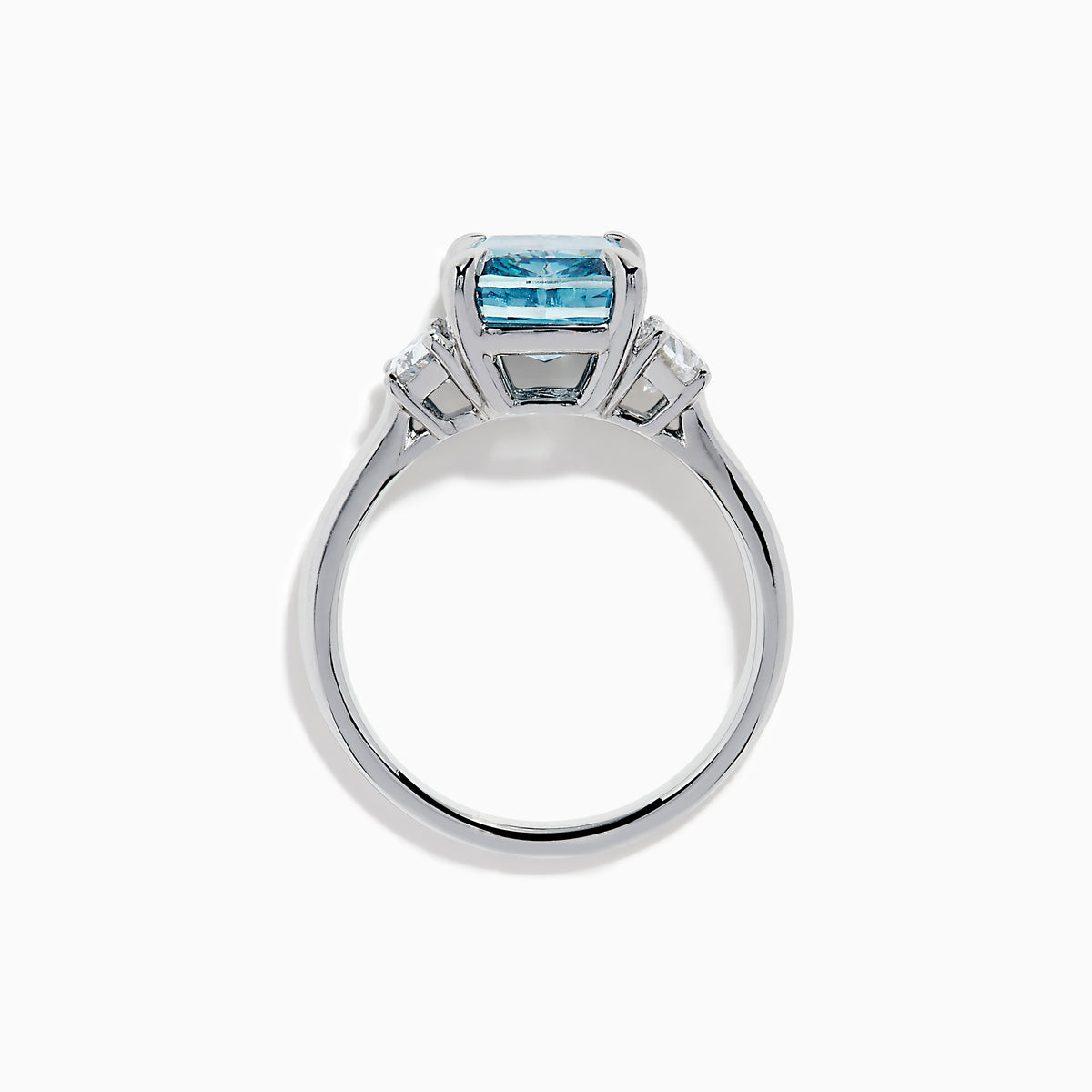 Lab Grown Blue and White Diamond 3-Stone Ring in 14K White Gold, featuring a prominent cushion-cut blue and white diamond center with two clear triangular side stones, shown on a white background.