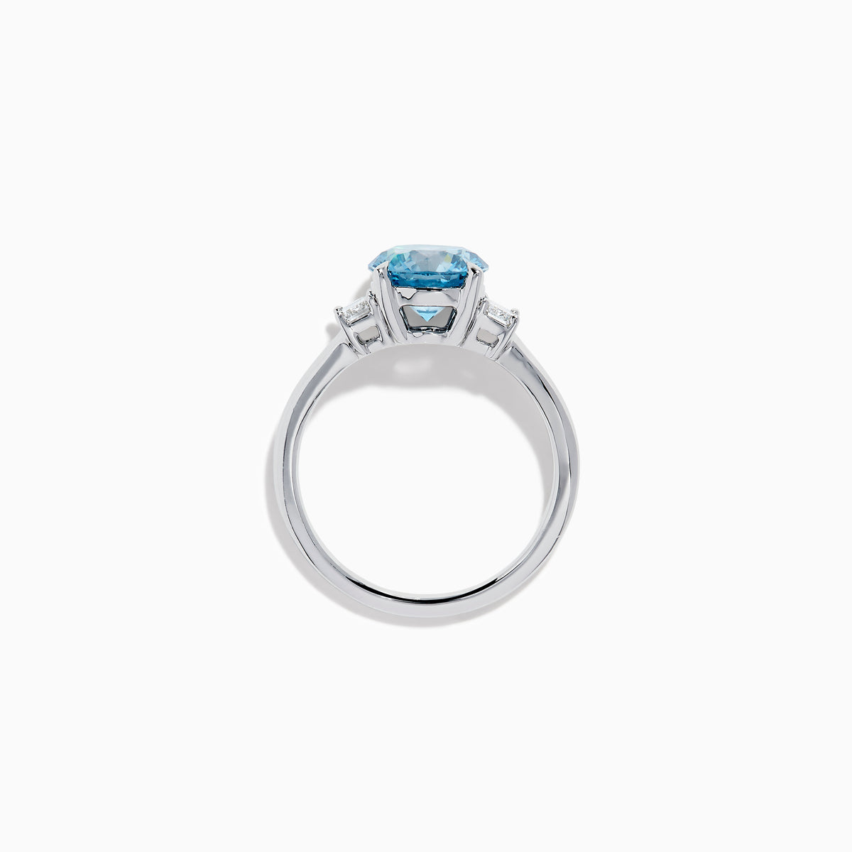 The Lab Grown Blue and White Diamond 3 Stone Ring in 14K White Gold features a striking round blue gemstone center with two rectangular lab grown diamonds on each side, all set in elegant white gold.