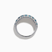 The Lab Grown Blue and White Diamond Wide Band Ring in 14K White Gold showcases a central row of blue stones flanked by lab grown diamonds in a striking triple-band design.