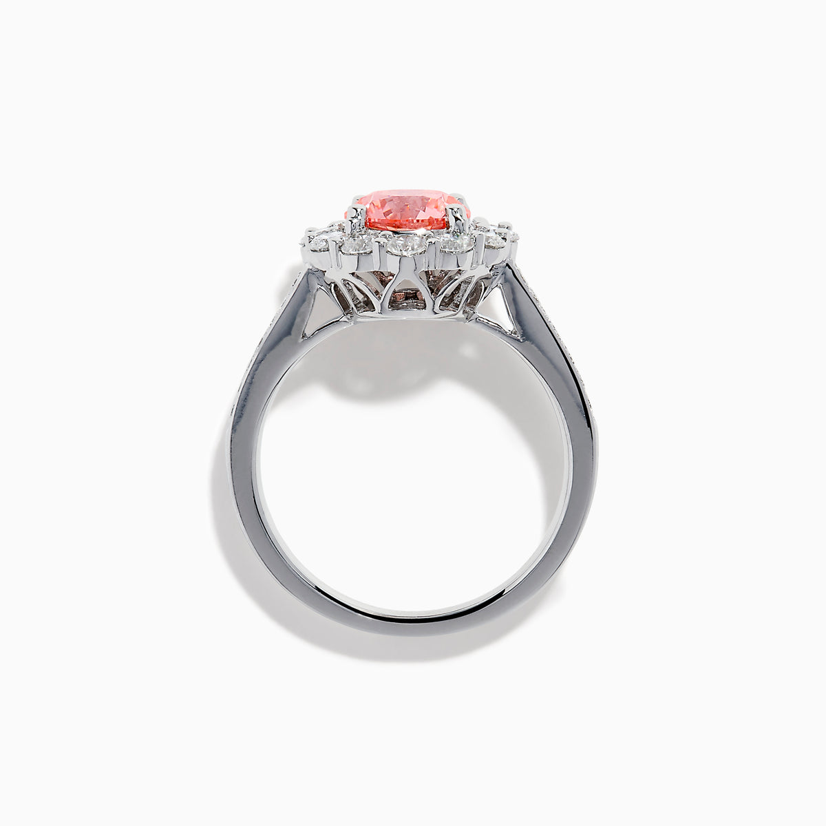 The Lab Grown Pink and White Diamond Halo Ring in 14K White Gold features a round pink gemstone center, surrounded by a halo of lab grown diamonds and additional diamonds along the elegant band.