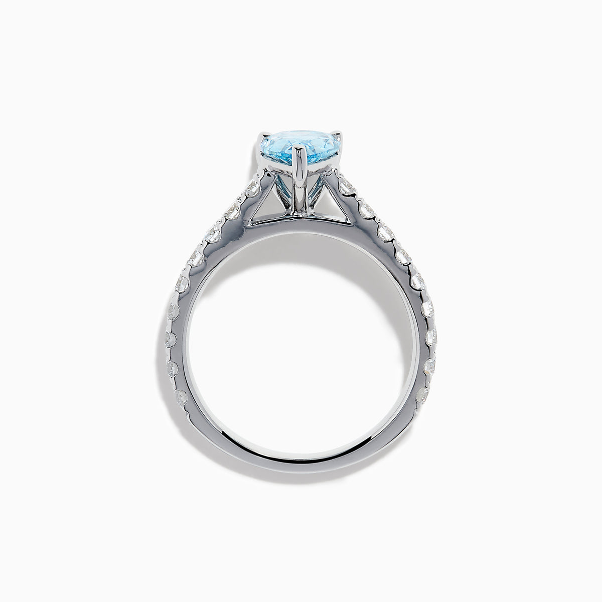 The Lab Grown Blue Diamond Solitaire Pear Ring in 14K White Gold features a striking pear-shaped blue diamond at the center, accented by a band adorned with small round white diamonds.