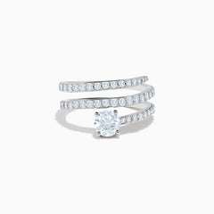 The Lab Grown Diamond Wrap Around Round Ring in 14K white gold showcases three curved, diamond-studded bands and a large round lab diamond at the center, set against a white background.