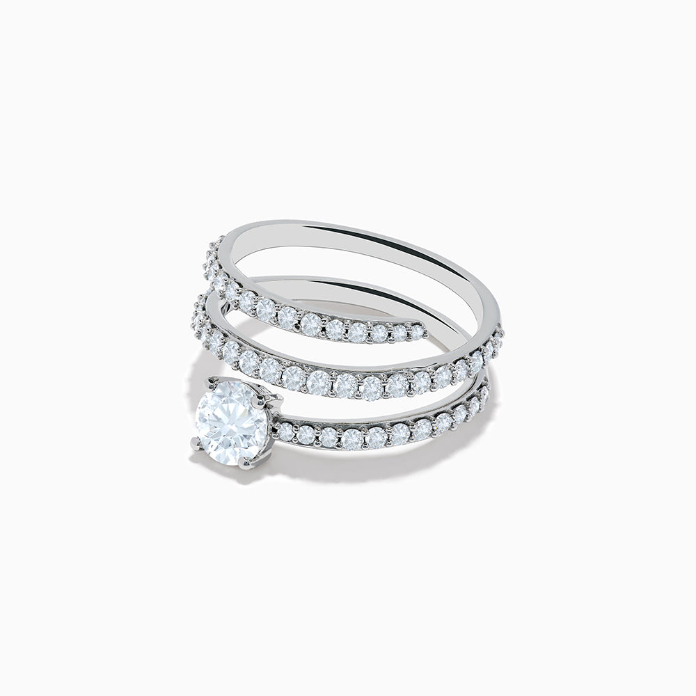 The Lab Grown Diamond Wrap Around Round Ring in 14K white gold showcases three curved, diamond-studded bands and a large round lab diamond at the center, set against a white background.