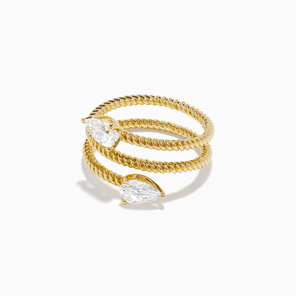 A Lab Grown Diamond Wrap around Toi et Moi Ring in 14K Yellow Gold features an open twisted band with two pear-shaped diamonds at each end, shown on a plain white background.
