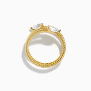 A Lab Grown Diamond Wrap around Toi et Moi Ring in 14K Yellow Gold features an open twisted band with two pear-shaped diamonds at each end, shown on a plain white background.