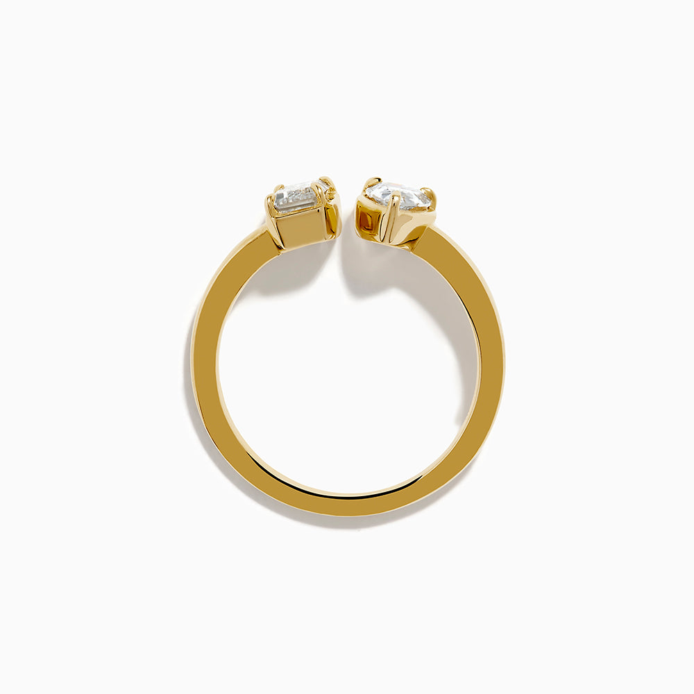 The Lab Grown Diamond Toi Et Moi Ring in 14K Yellow Gold features a pear-shaped diamond and an emerald-cut lab diamond set side by side on a plain gold band, displayed on a white background.