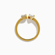 The Lab Grown Diamond Toi Et Moi Ring in 14K Yellow Gold features a pear-shaped diamond and an emerald-cut lab diamond set side by side on a plain gold band, displayed on a white background.