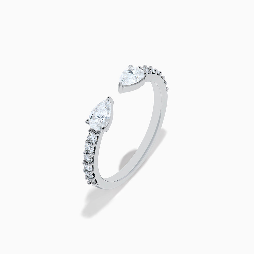 The Lab Grown Diamond Open Shank Pear Band in 14K white gold features two pear-shaped diamonds at each end and small round stones along the band.