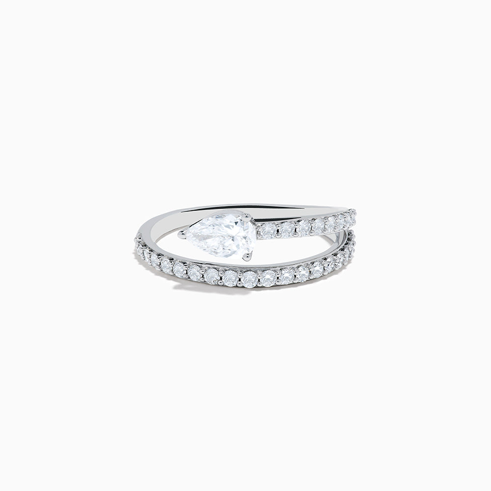 The Lab Grown Diamond Wrap around Pear Ring in 14K White Gold showcases a pear-shaped central diamond and a split shank adorned with lab diamonds, elegantly displayed on a plain white background.