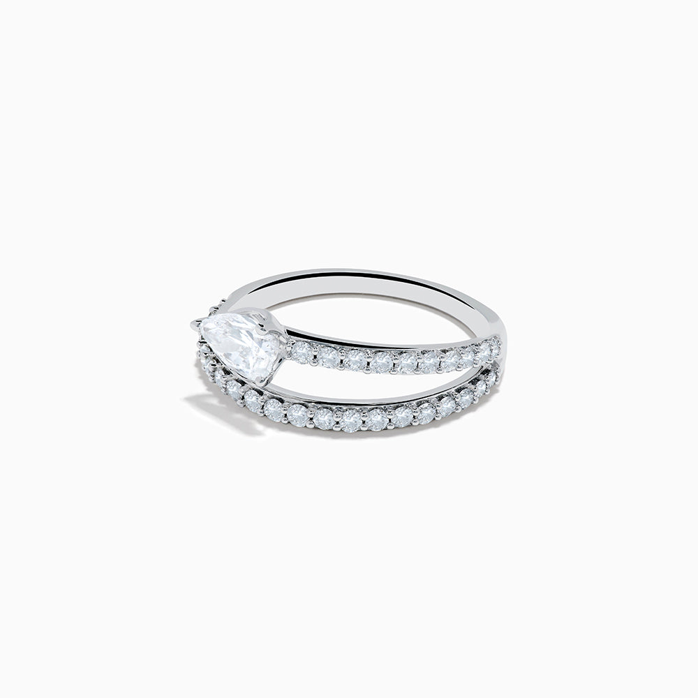 The Lab Grown Diamond Wrap around Pear Ring in 14K White Gold showcases a pear-shaped central diamond and a split shank adorned with lab diamonds, elegantly displayed on a plain white background.