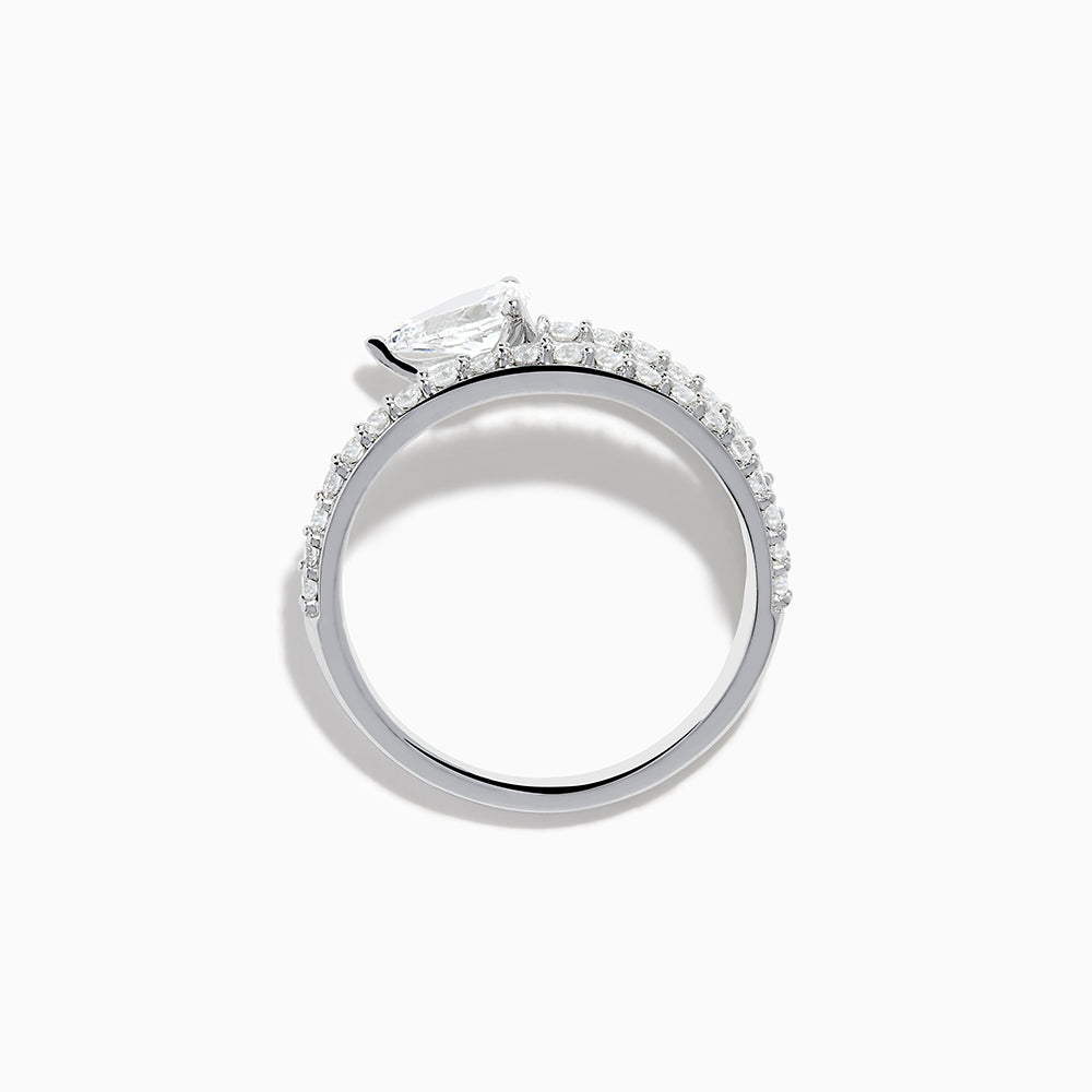 The Lab Grown Diamond Wrap around Pear Ring in 14K White Gold showcases a pear-shaped central diamond and a split shank adorned with lab diamonds, elegantly displayed on a plain white background.
