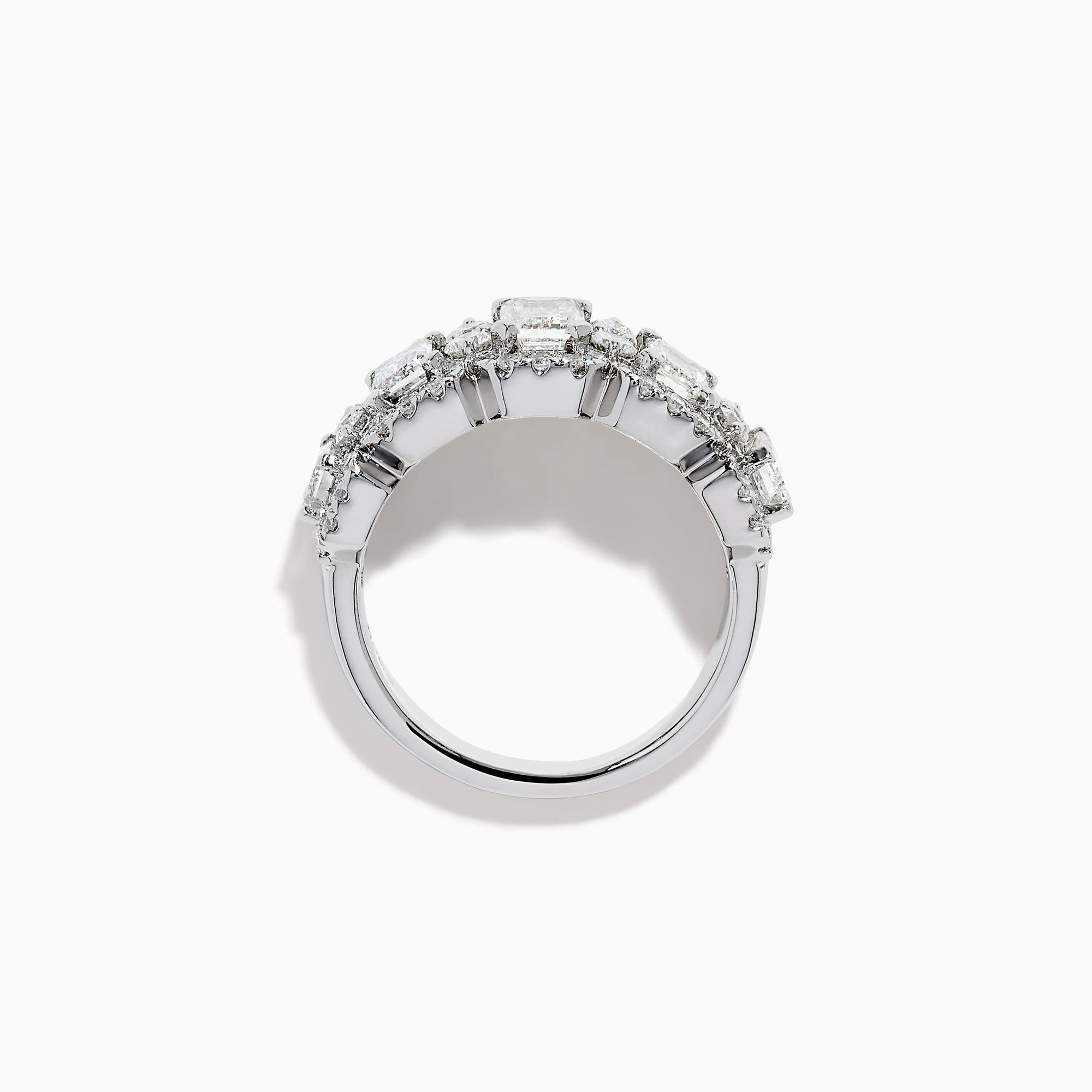 The Lab Grown Emerald Cut Diamond Halo Band in 14K White Gold showcases a luxurious row of large emerald-cut lab grown diamonds, accented by smaller round diamonds in an intricate halo design.