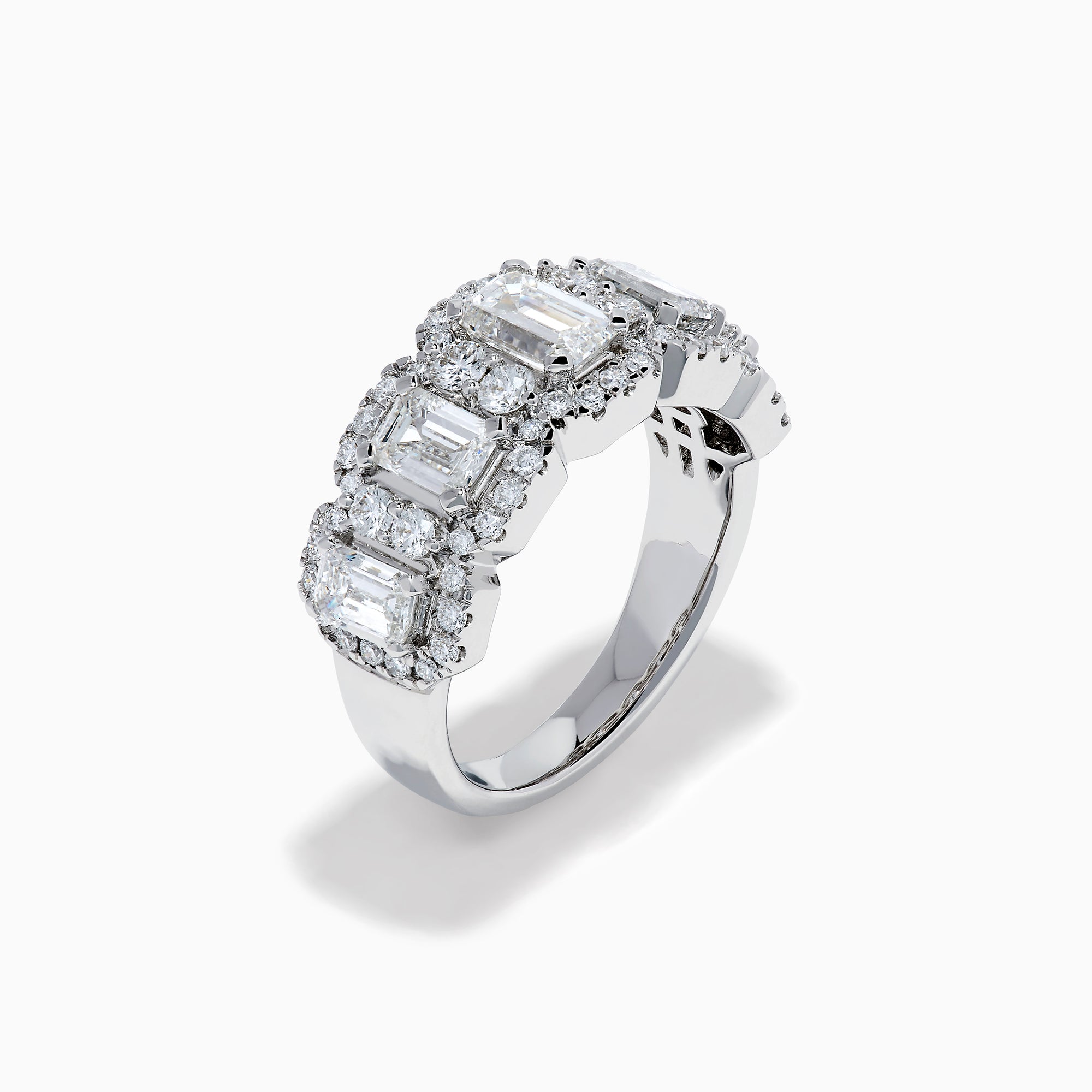 The Lab Grown Emerald Cut Diamond Halo Band in 14K White Gold showcases a luxurious row of large emerald-cut lab grown diamonds, accented by smaller round diamonds in an intricate halo design.