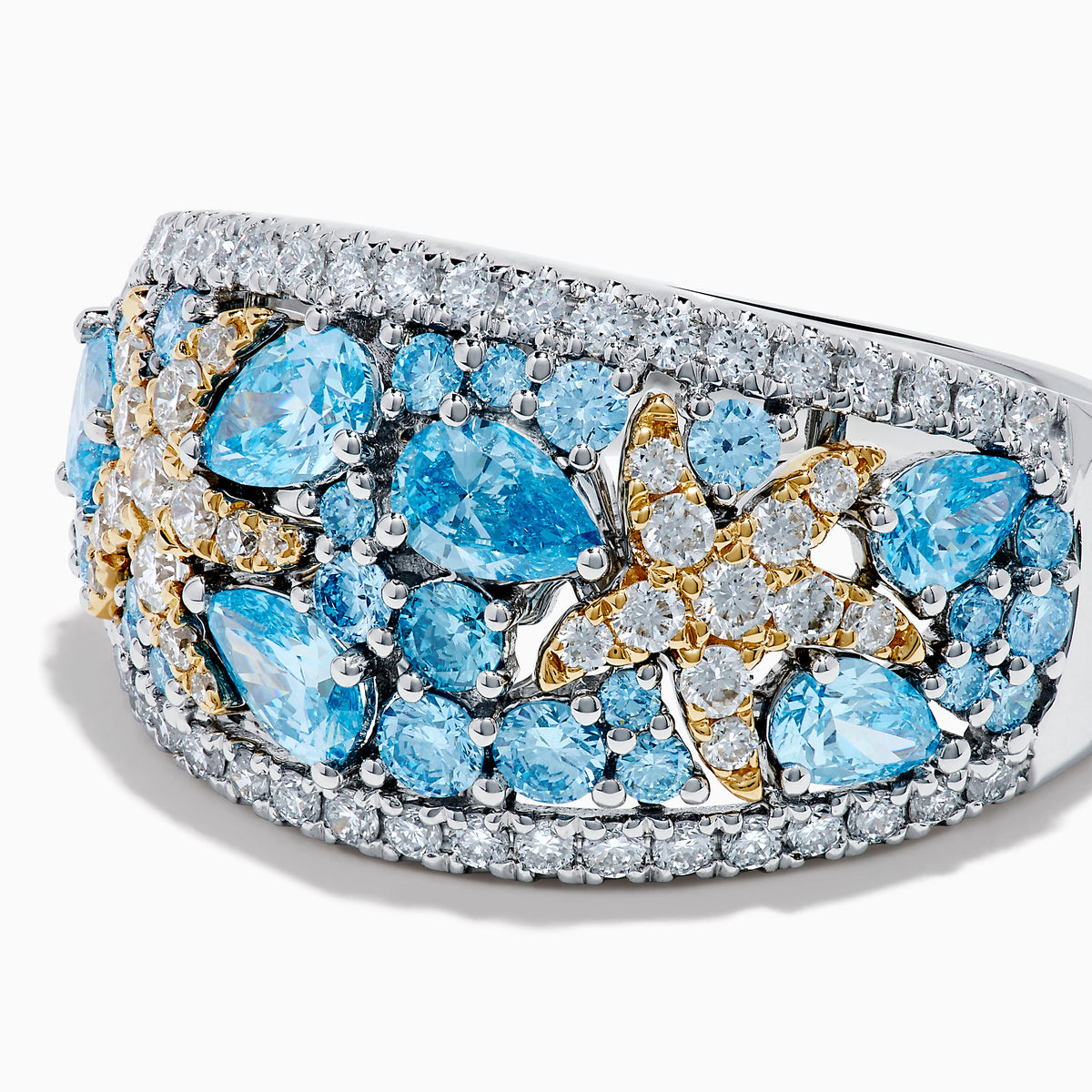 The Lab Grown Blue and White Diamond Starfish Ring in 14K Two Tone Gold features a wide silver band accented with clusters of light blue gemstones, two gold starfish, and sparkling lab grown diamonds, shown on a plain white background.