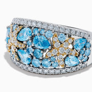 The Lab Grown Blue and White Diamond Starfish Ring in 14K Two Tone Gold features a wide silver band accented with clusters of light blue gemstones, two gold starfish, and sparkling lab grown diamonds, shown on a plain white background.