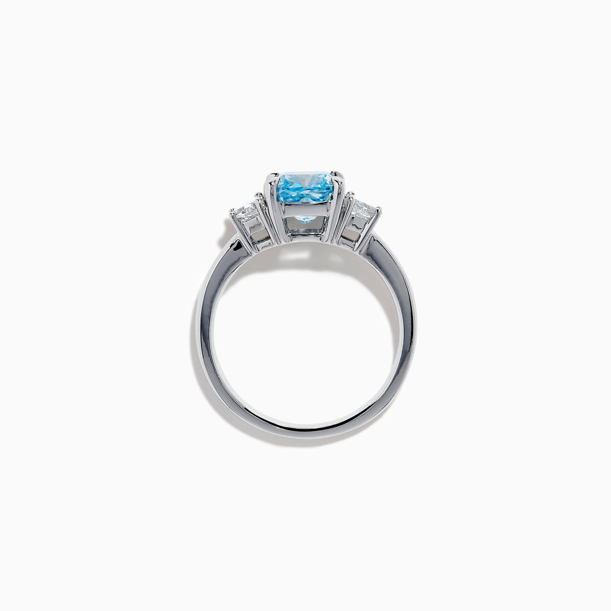 A Lab Grown Blue and White Diamond 3 Stone Ring in 14K White Gold showcases a central rectangular blue diamond flanked by two clear rectangular diamonds, set in gleaming white gold and displayed against a white background.