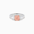The Lab Grown Pink and White Diamond 3 Stone Ring in 14K White Gold features a rectangular cushion-cut pink center stone with two smaller rectangular white diamonds on each side.
