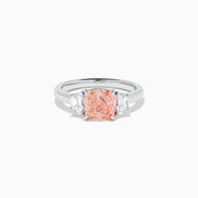 The Lab Grown Pink and White Diamond 3 Stone Ring in 14K White Gold features a rectangular cushion-cut pink center stone with two smaller rectangular white diamonds on each side.
