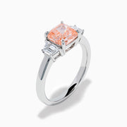 The Lab Grown Pink and White Diamond 3 Stone Ring in 14K White Gold features a rectangular cushion-cut pink center stone with two smaller rectangular white diamonds on each side.