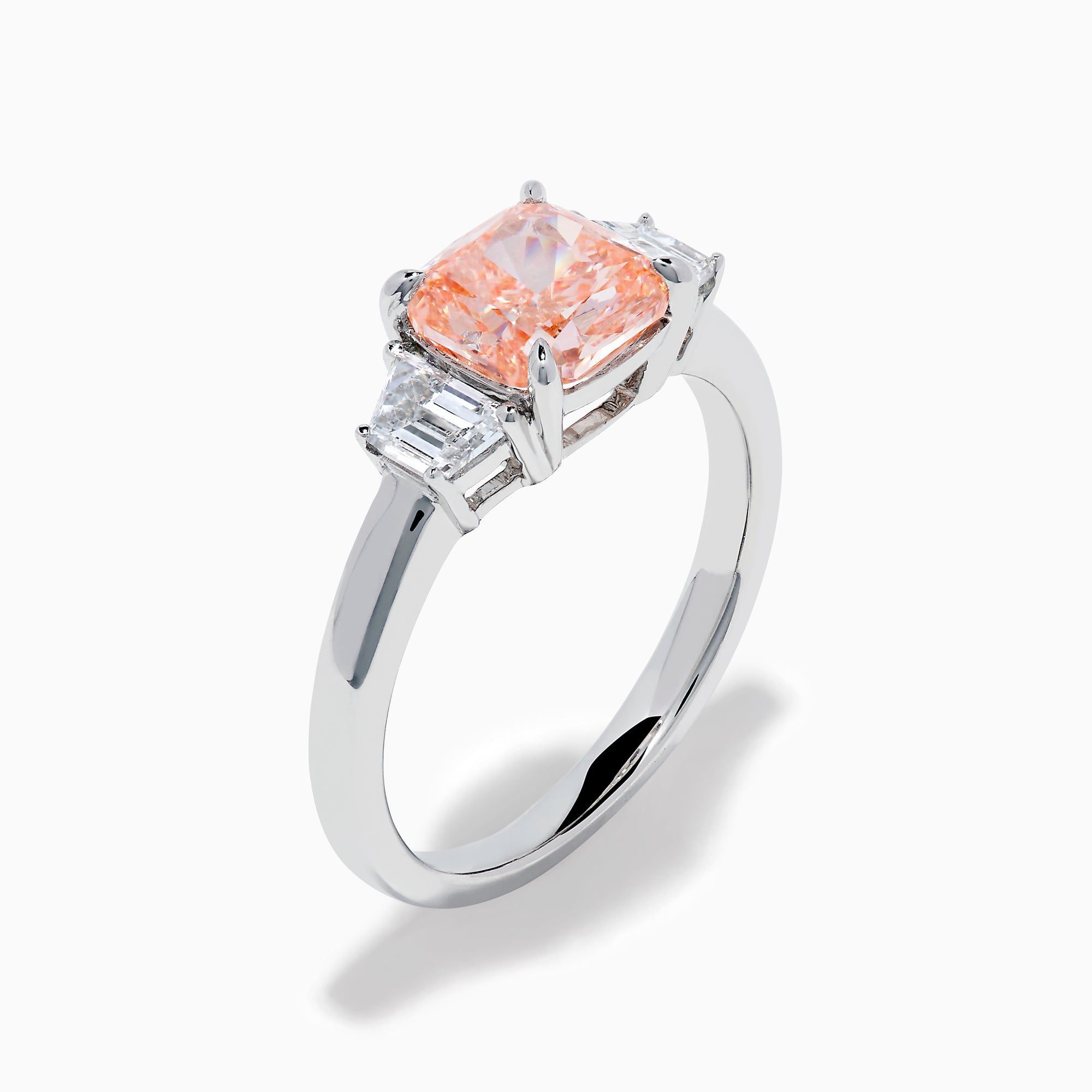 The Lab Grown Pink and White Diamond 3 Stone Ring in 14K White Gold features a rectangular cushion-cut pink center stone with two smaller rectangular white diamonds on each side.