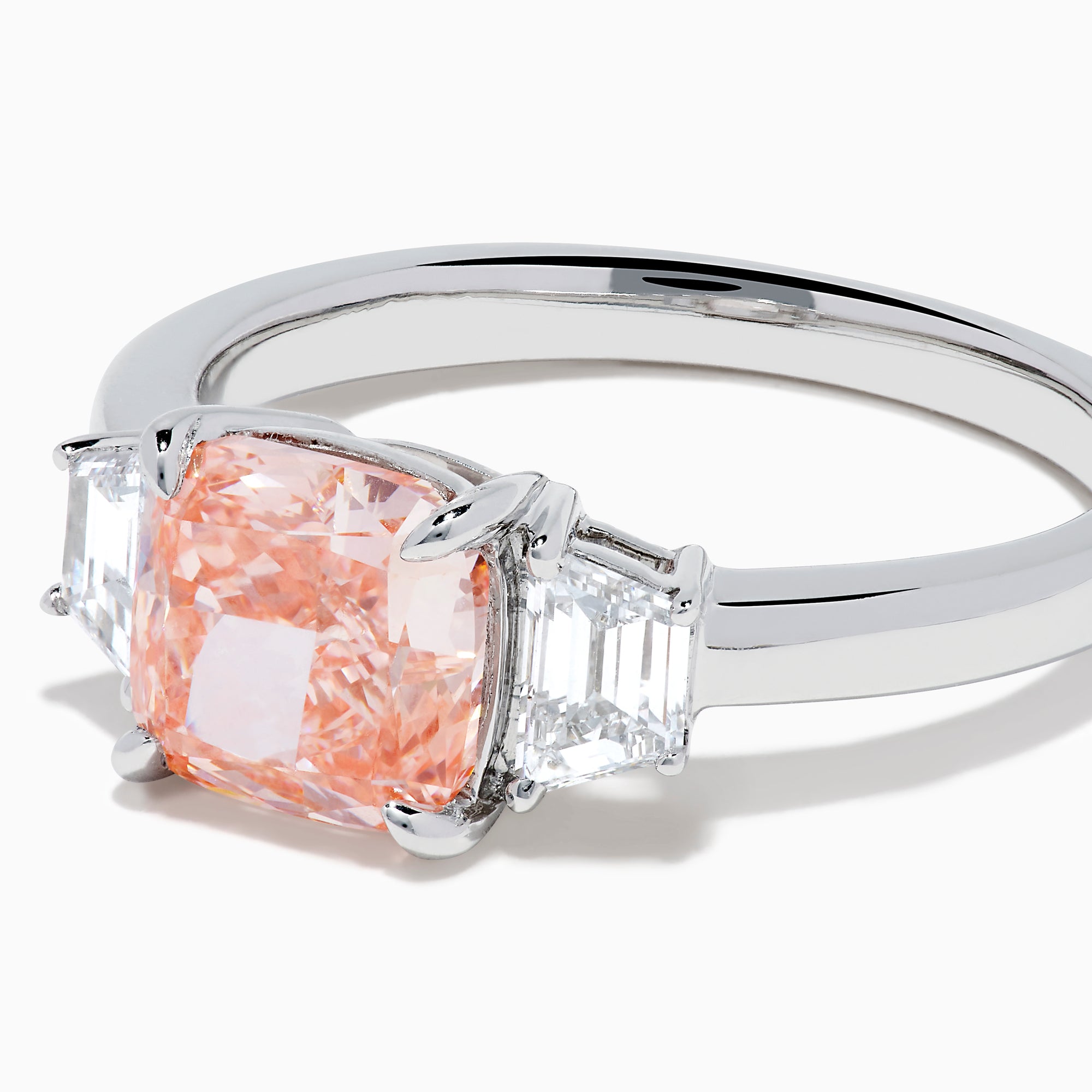 The Lab Grown Pink and White Diamond 3 Stone Ring in 14K White Gold features a rectangular cushion-cut pink center stone with two smaller rectangular white diamonds on each side.