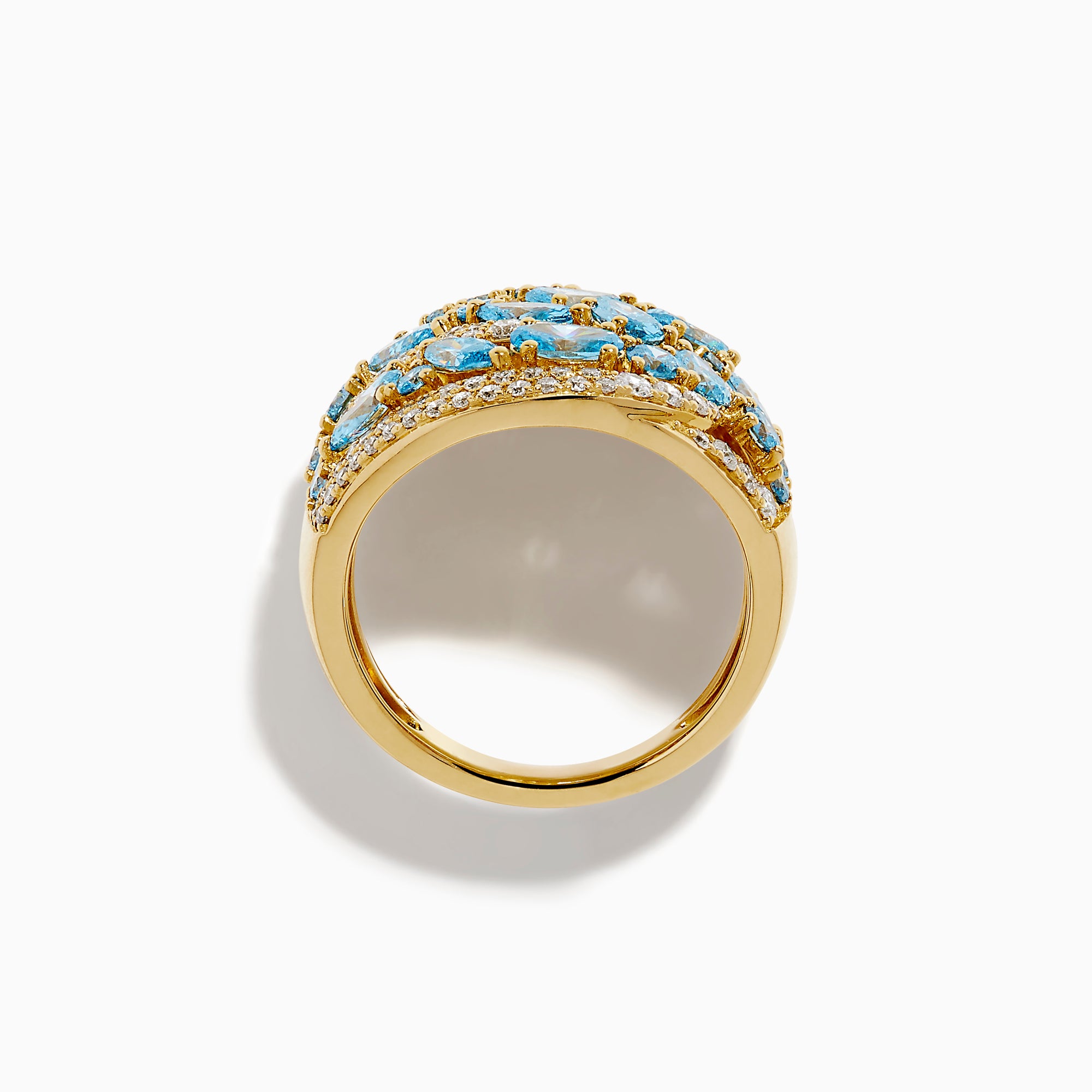 Make a statement with our Lab Grown Blue and White Diamond Statement Ring in 14K Yellow Gold, featuring marquise-cut blue stones and rows of lab-grown diamonds in an elegant wavy design.