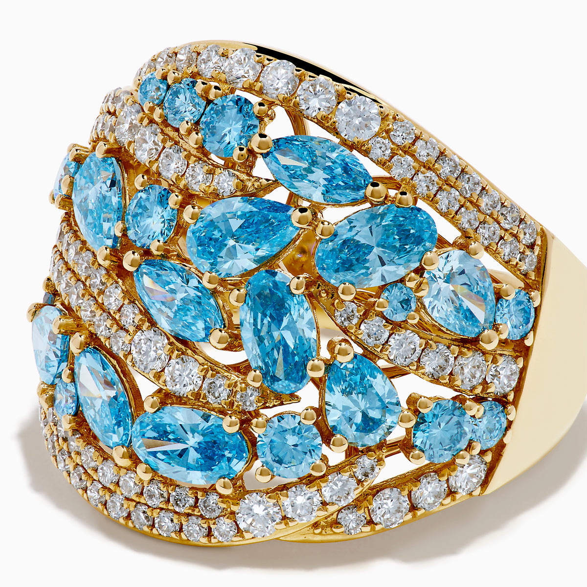 Make a statement with our Lab Grown Blue and White Diamond Statement Ring in 14K Yellow Gold, featuring marquise-cut blue stones and rows of lab-grown diamonds in an elegant wavy design.