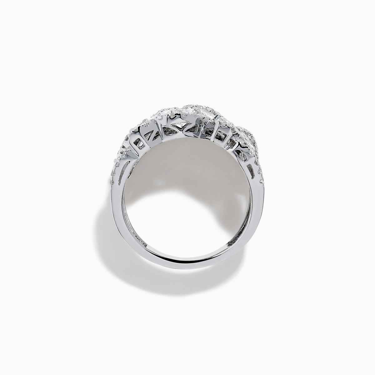 The Lab Grown Multi Shape Diamond Wide Ring in 14K White Gold displays marquise, baguette, and round-cut lab grown diamonds set in an elaborate, interwoven silver design for a sparkling, textured look.