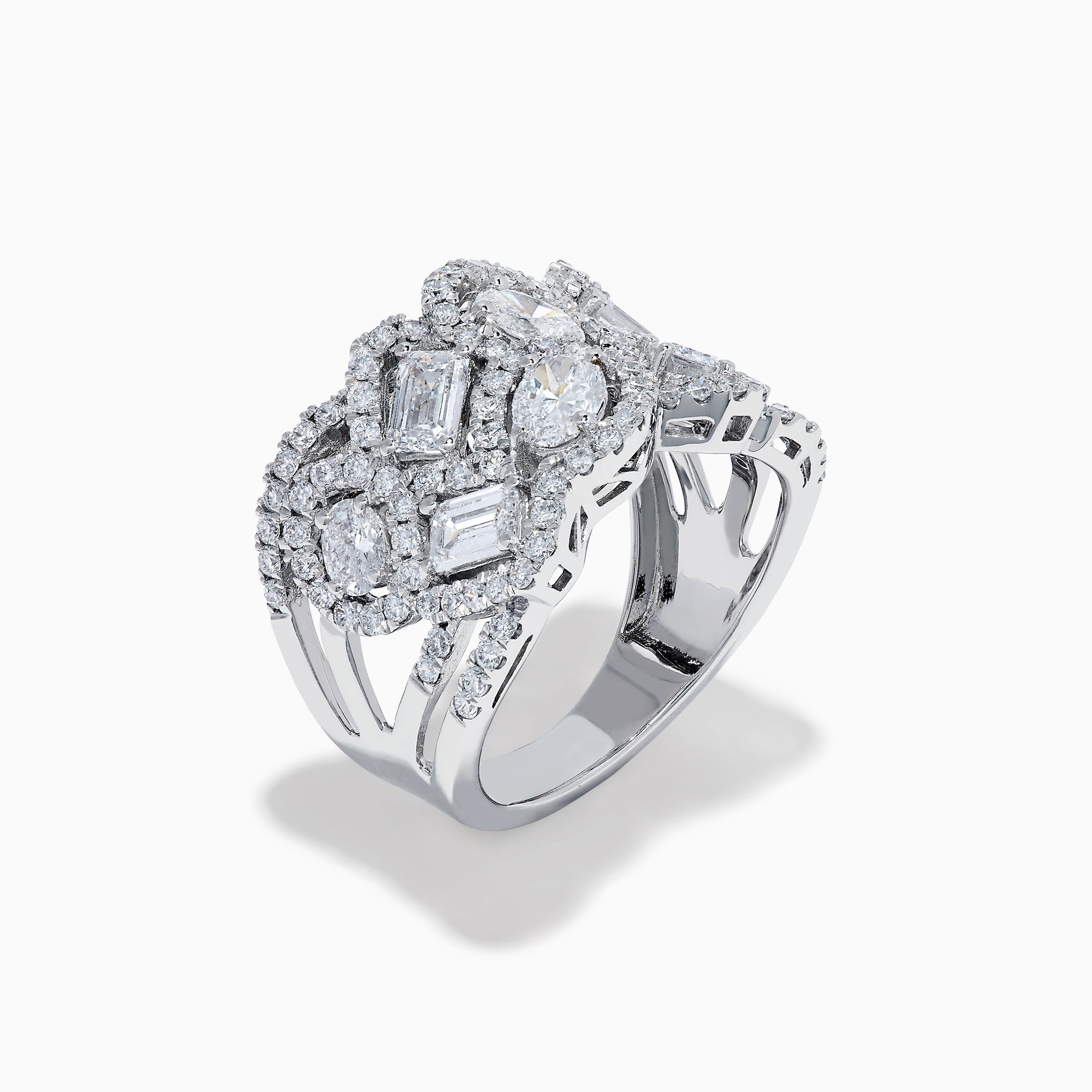 The Lab Grown Multi Shape Diamond Wide Ring in 14K White Gold displays marquise, baguette, and round-cut lab grown diamonds set in an elaborate, interwoven silver design for a sparkling, textured look.