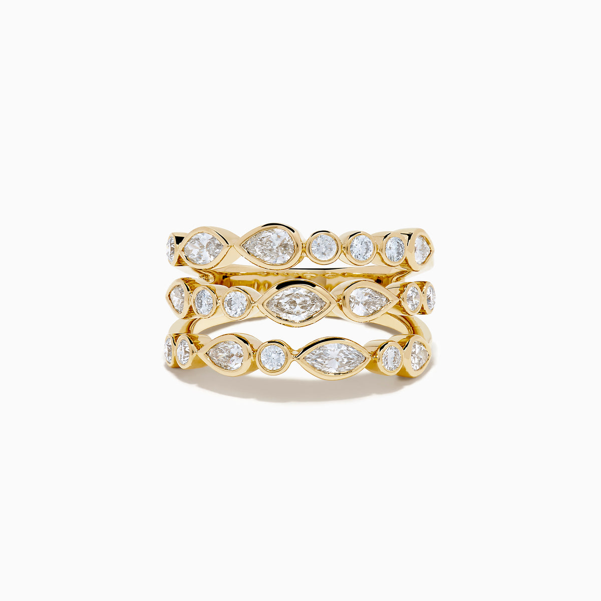 The Lab Grown Multi Shape Diamond Triple Row Bezel Ring in 14K Yellow Gold features three stacked bands with round and marquise lab grown diamonds set in bezel settings, creating a repeating diamond pattern around each row.