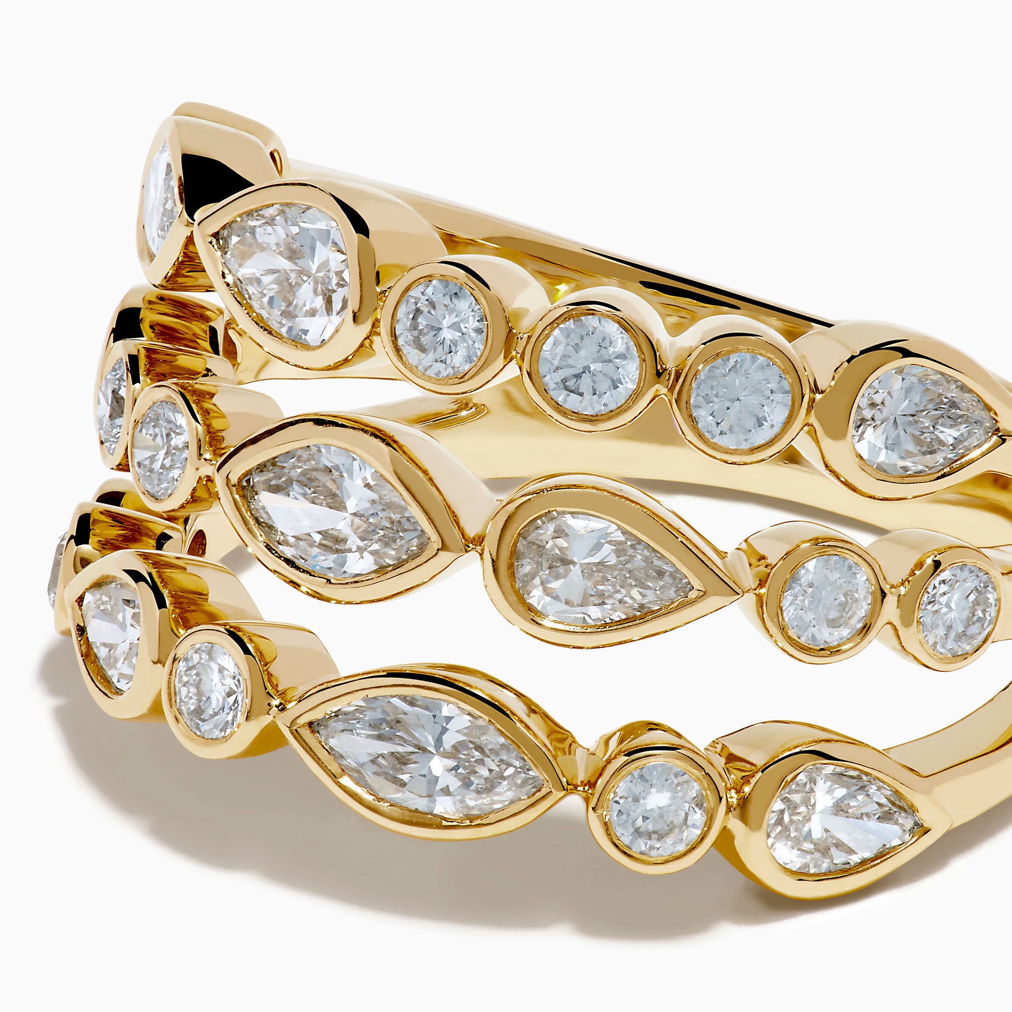 The Lab Grown Multi Shape Diamond Triple Row Bezel Ring in 14K Yellow Gold features three stacked bands with round and marquise lab grown diamonds set in bezel settings, creating a repeating diamond pattern around each row.