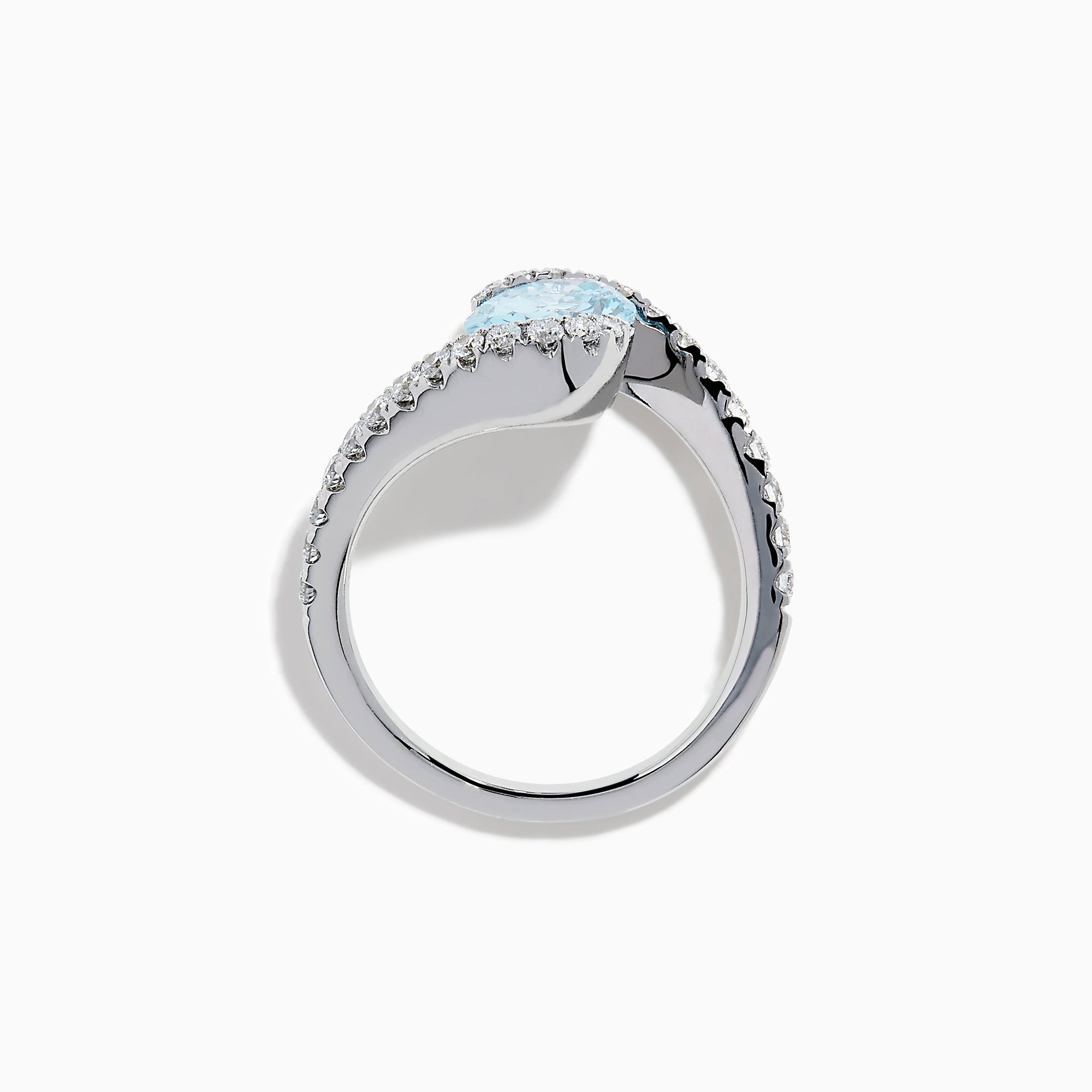 The Lab Grown Blue and White Diamond Connect Ring in 14K White Gold features an oval blue gemstone center, accented with lab grown diamonds on a curved band, shown against a plain white background.