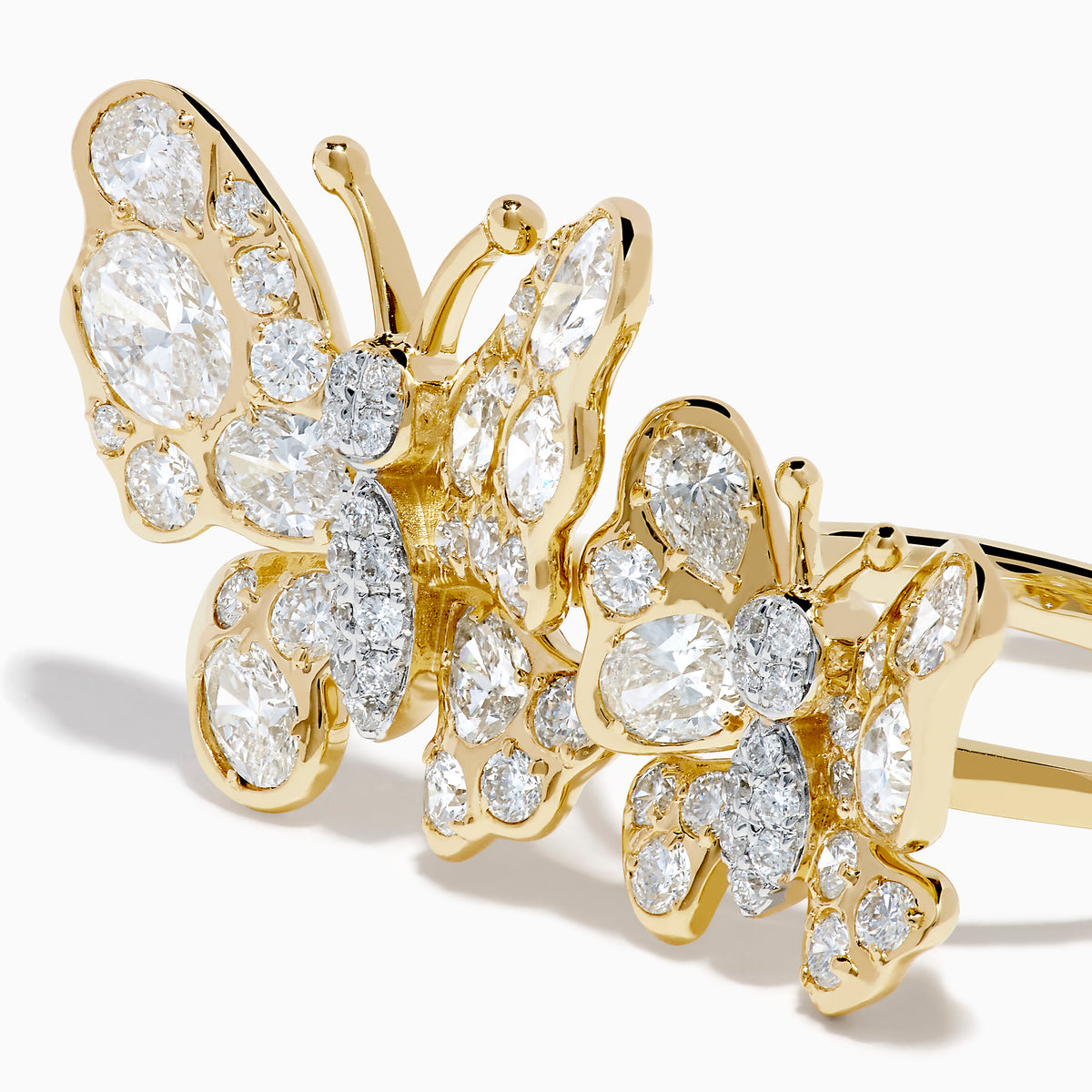 The Lab Grown Multi Shape Diamond Butterfly Ring in 14K Yellow Gold features two butterflies of varying sizes, each adorned with sparkling lab grown diamonds, displayed on a plain white background.