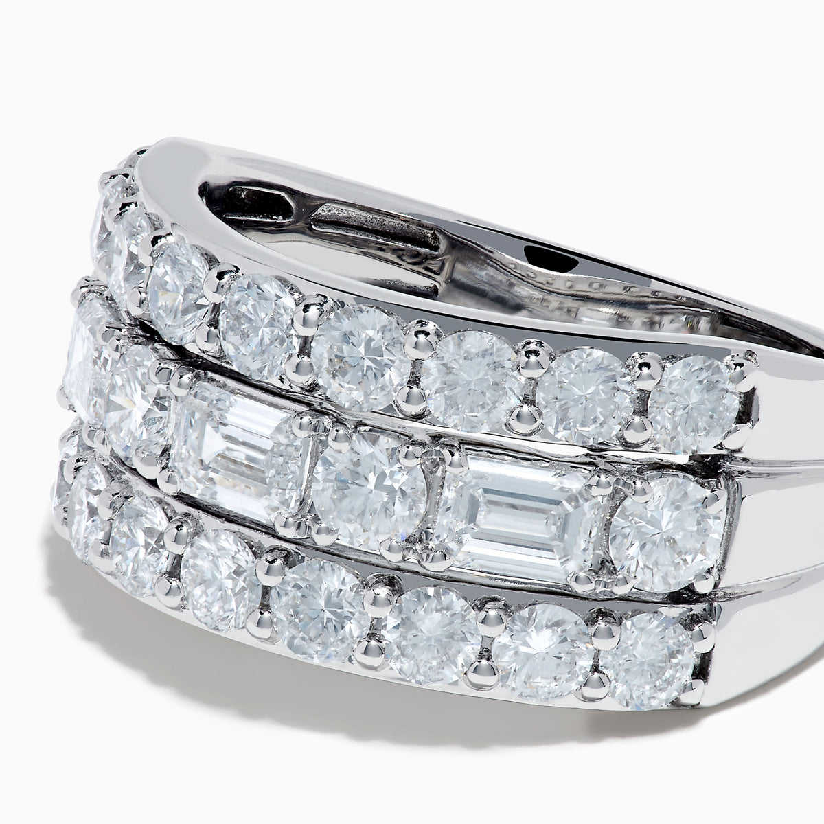 A close-up of the Lab Grown Multi Shape Diamond Wide Band in 14K White Gold, showcasing three rows of round and square diamonds in a curved, stacked design against a white background.