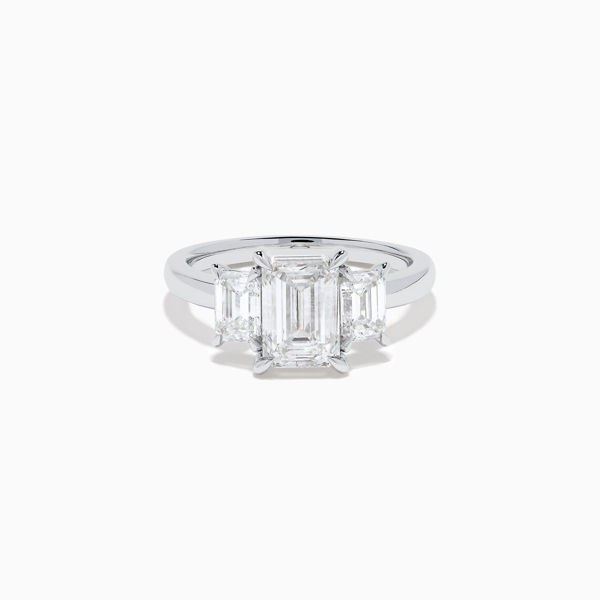 The Lab Grown Emerald Cut Diamond 3 Stone Ring in 14K White Gold features a central emerald-cut lab-grown diamond flanked by two rectangular diamonds on each side.