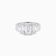 The Lab Grown Emerald Cut Diamond 3 Stone Ring in 14K White Gold features a central emerald-cut lab-grown diamond flanked by two rectangular diamonds on each side.