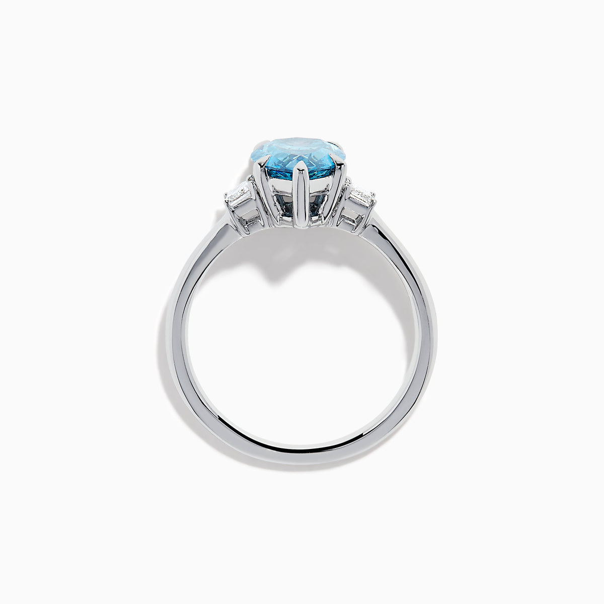 The Lab Grown Blue and White Diamond 3-Stone Ring in 14K White Gold features a large pear-shaped blue gemstone center with two rectangular lab grown diamonds, all set in white gold and displayed on a white background.