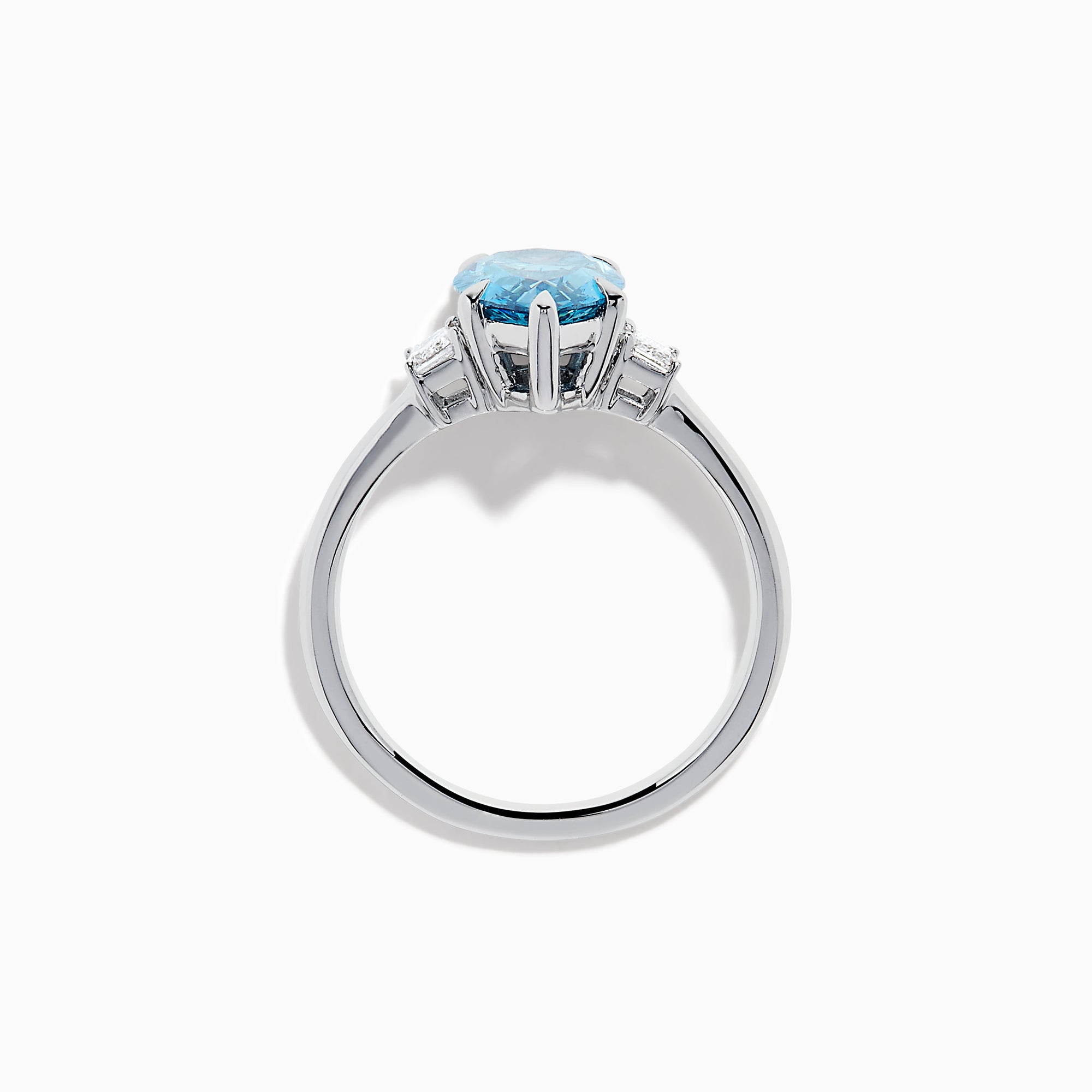 The Lab Grown Blue and White Diamond 3-Stone Ring in 14K White Gold features a large pear-shaped blue gemstone center with two rectangular lab grown diamonds, all set in white gold and displayed on a white background.